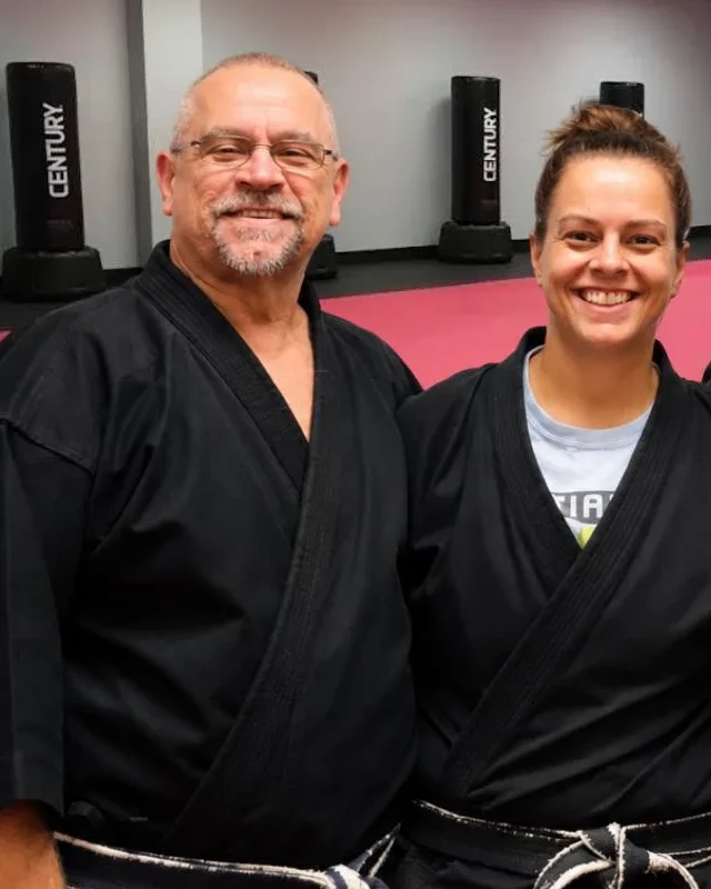 Sensei Bill Roeder with his daughter Sensei Jackie Roeder on the red mats at Waverly Martial Arts in Patchogue